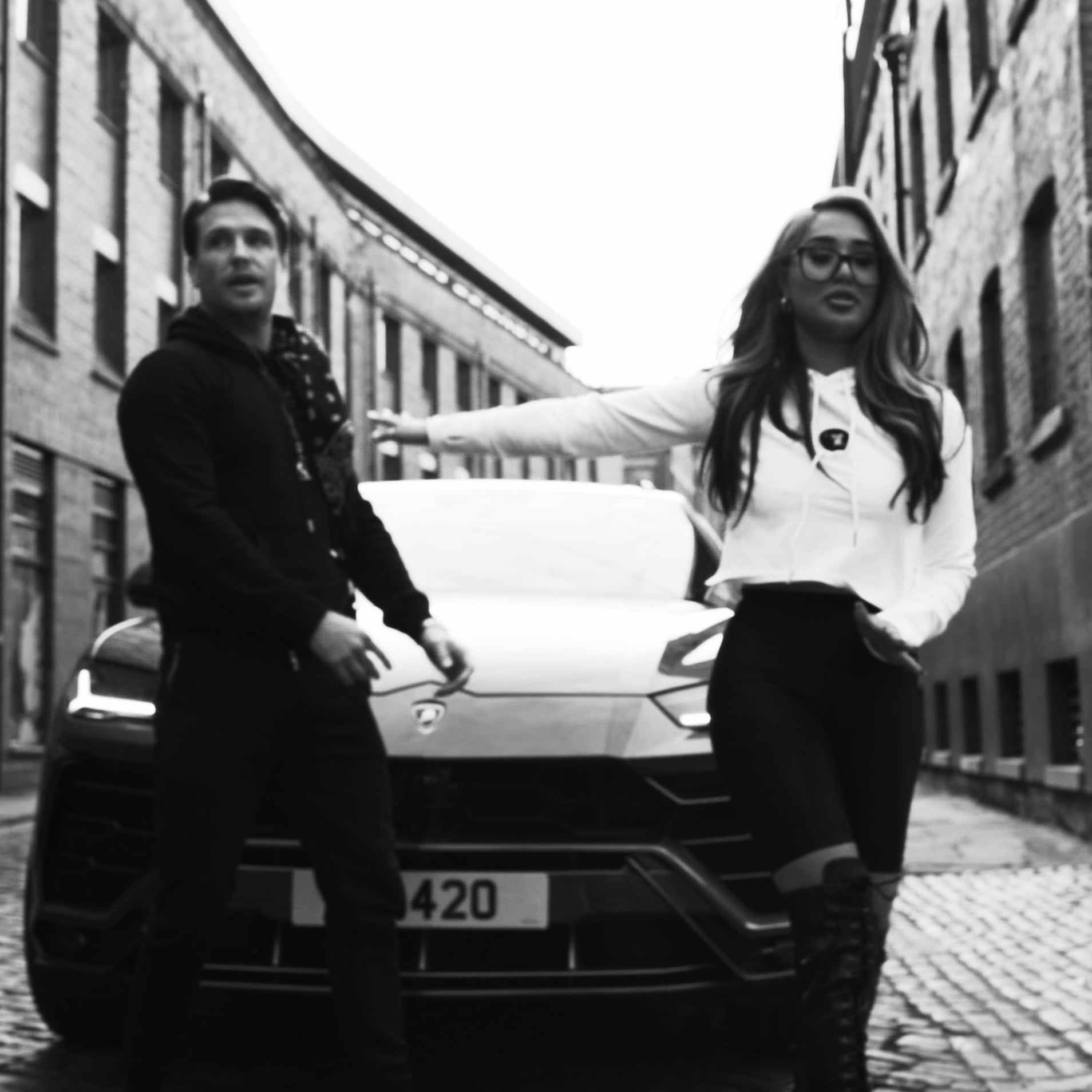 Tom and Zahida outside car